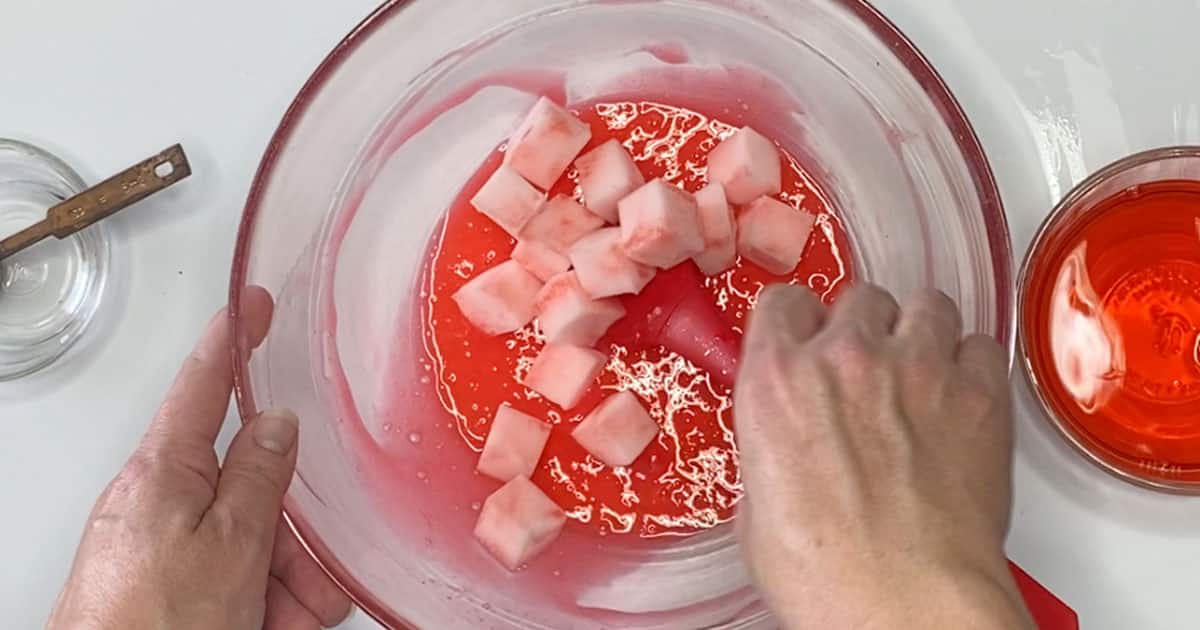 adding jelly cubes to slime to make Apple Jelly Cube Slime