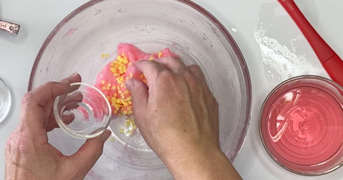 adding slime charms to make Pink Lemonade Jelly Cube Slime