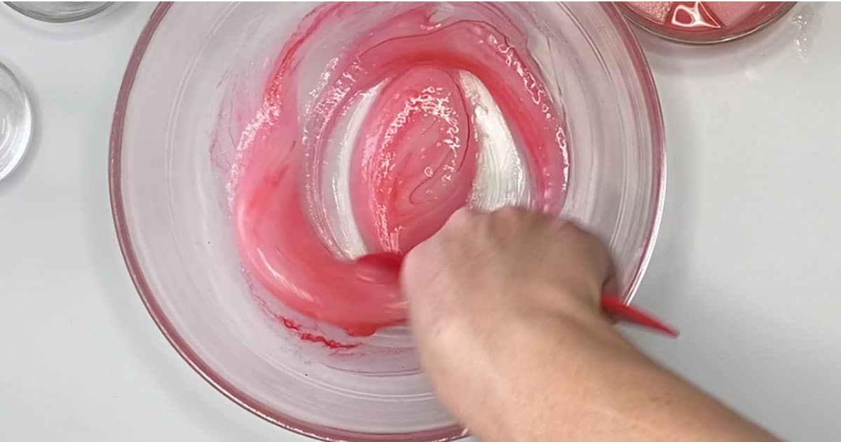 in-process of mixing together ingredients to make Pink Lemonade Jelly Cube Slime