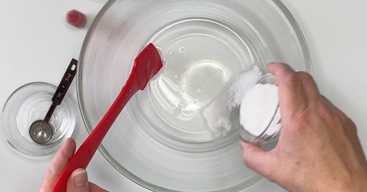 combining ingredients to make cherry icee slime
