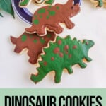 dino cookies on a platewith text which reads dinosaur cookies