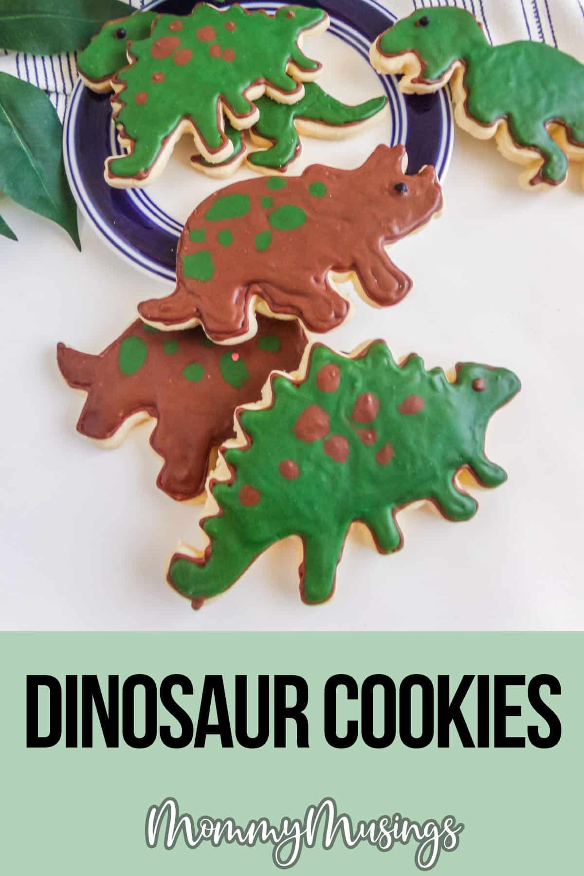 dino cookies on a platewith text which reads dinosaur cookies