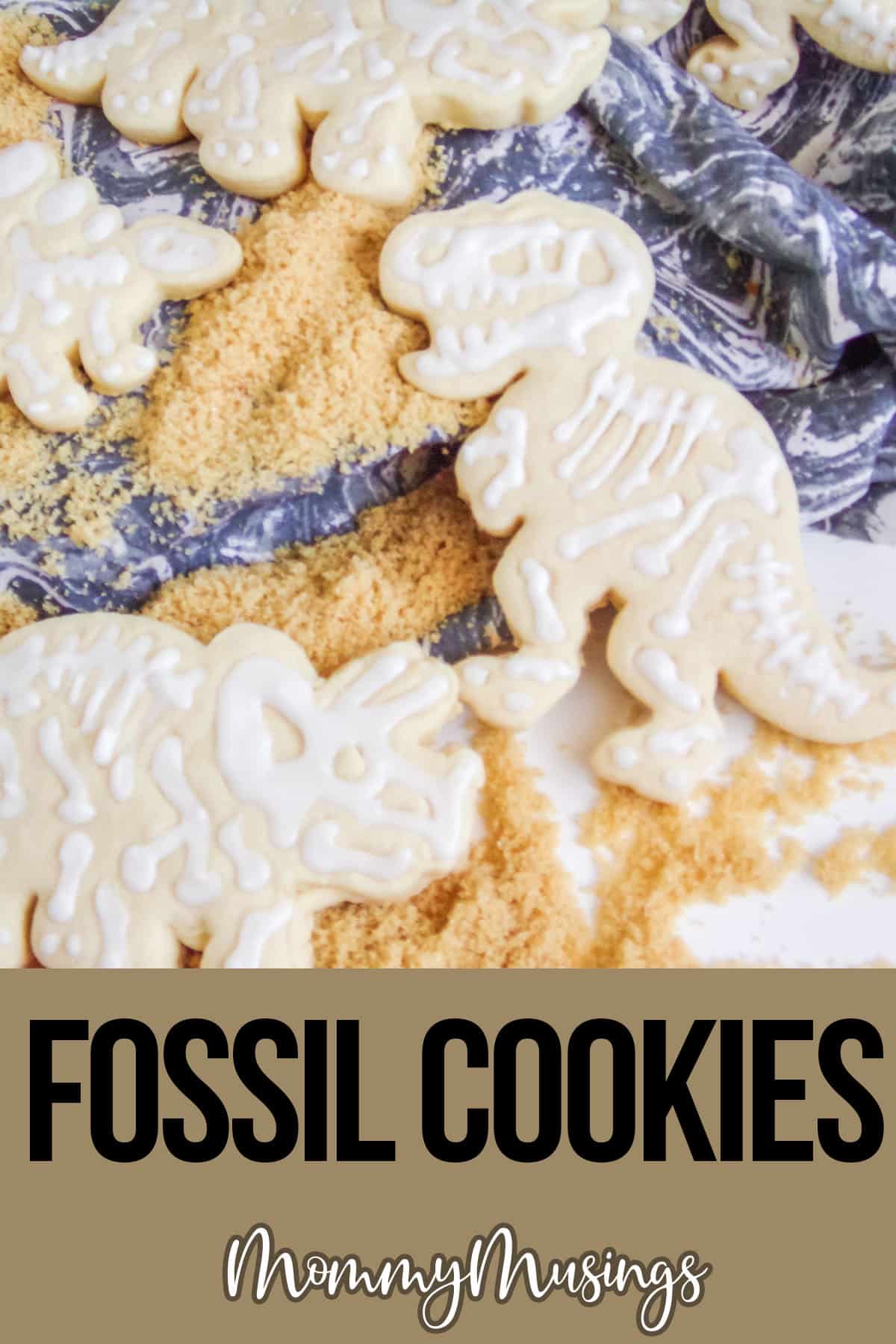 dinosaur fossil cut-out cookies with text which reads fossil cookies