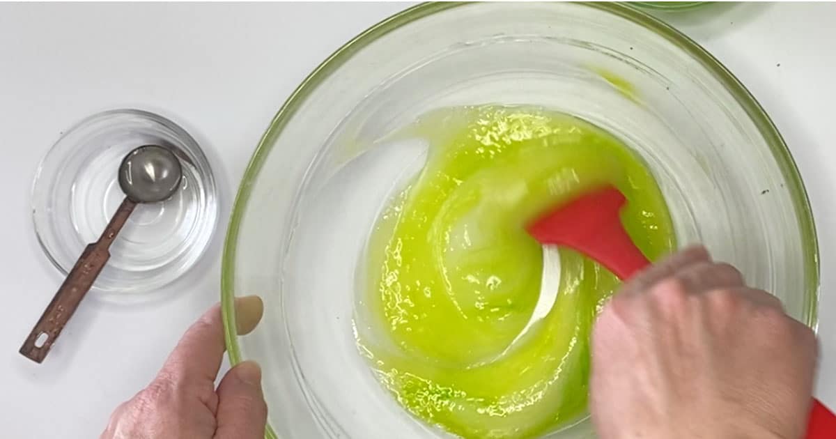 ingredients being combined to make kiwi jelly cube slime