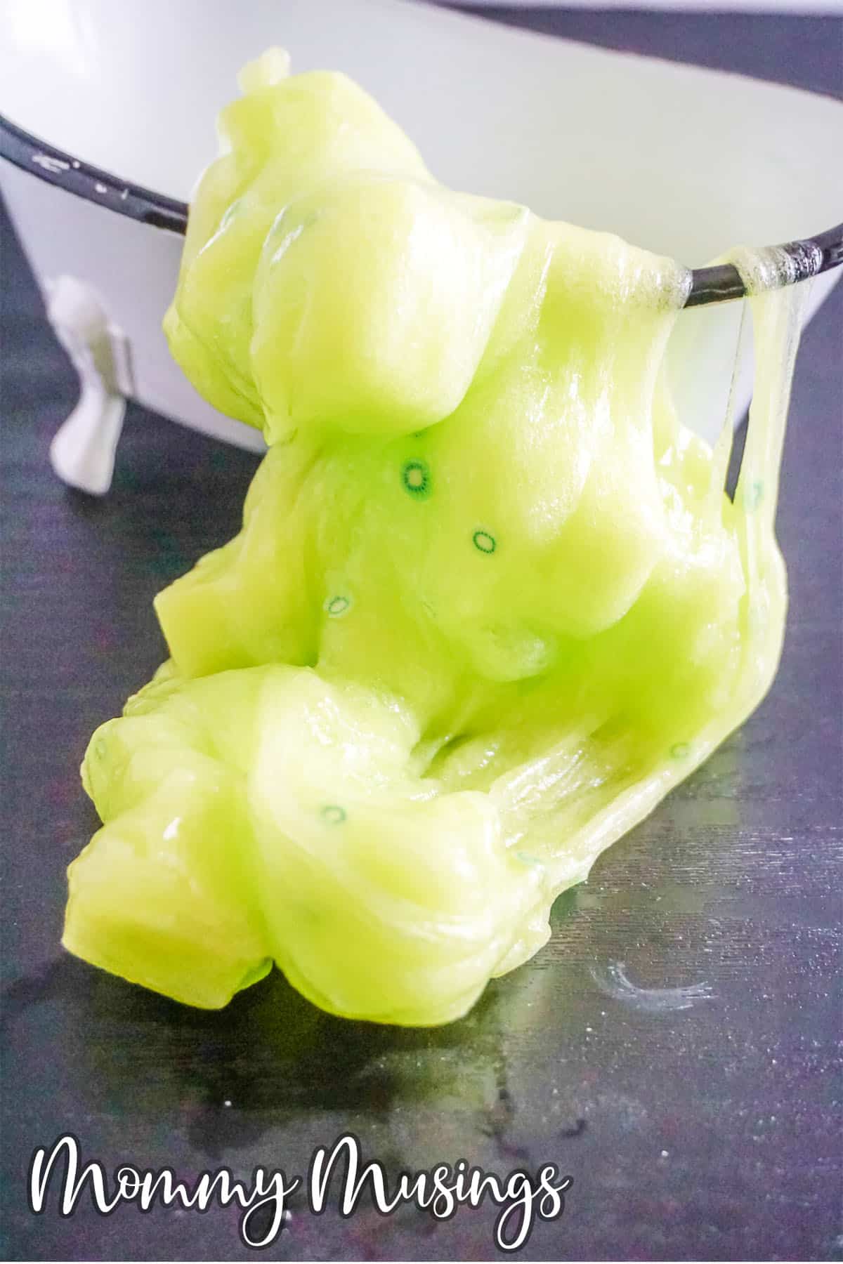 kiwi jelly cube slime spilling onto a table