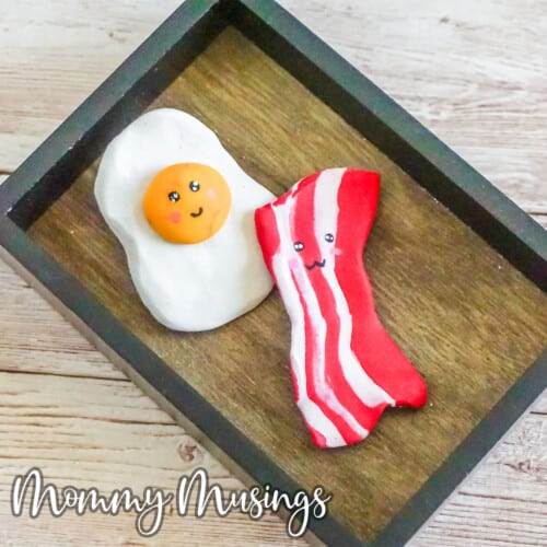 overhead view kids craft clay charms bacon and egg