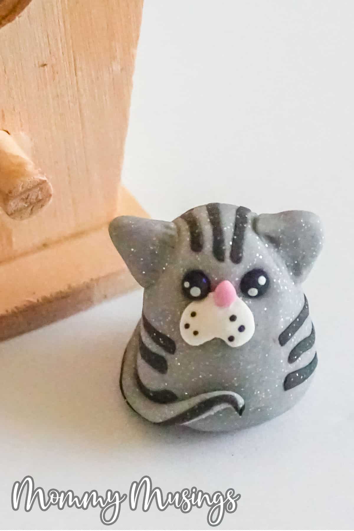 closeup of kitty cat charm made from clay