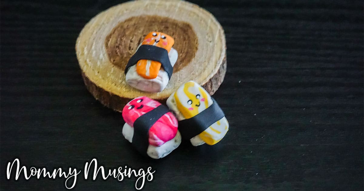 adorable polymer clay sushi charms on a black background
