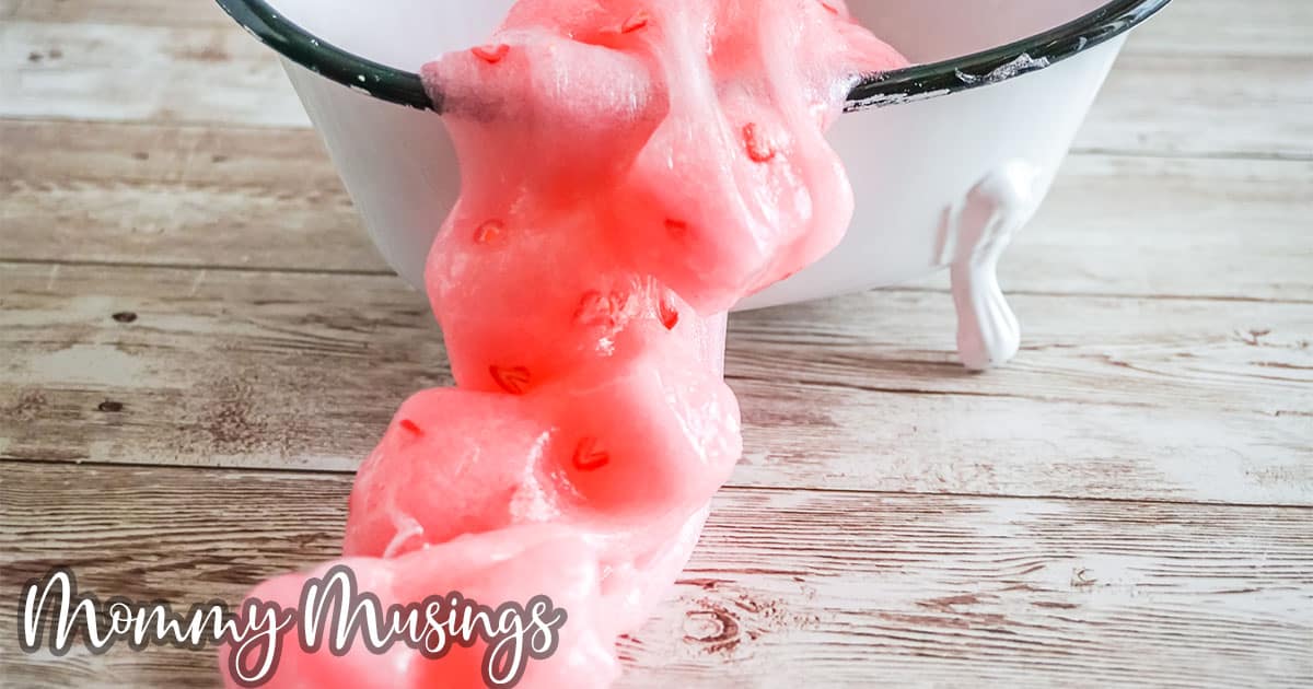 strawberry jelly cube slime spilling out of a tiny bathtub onto the table