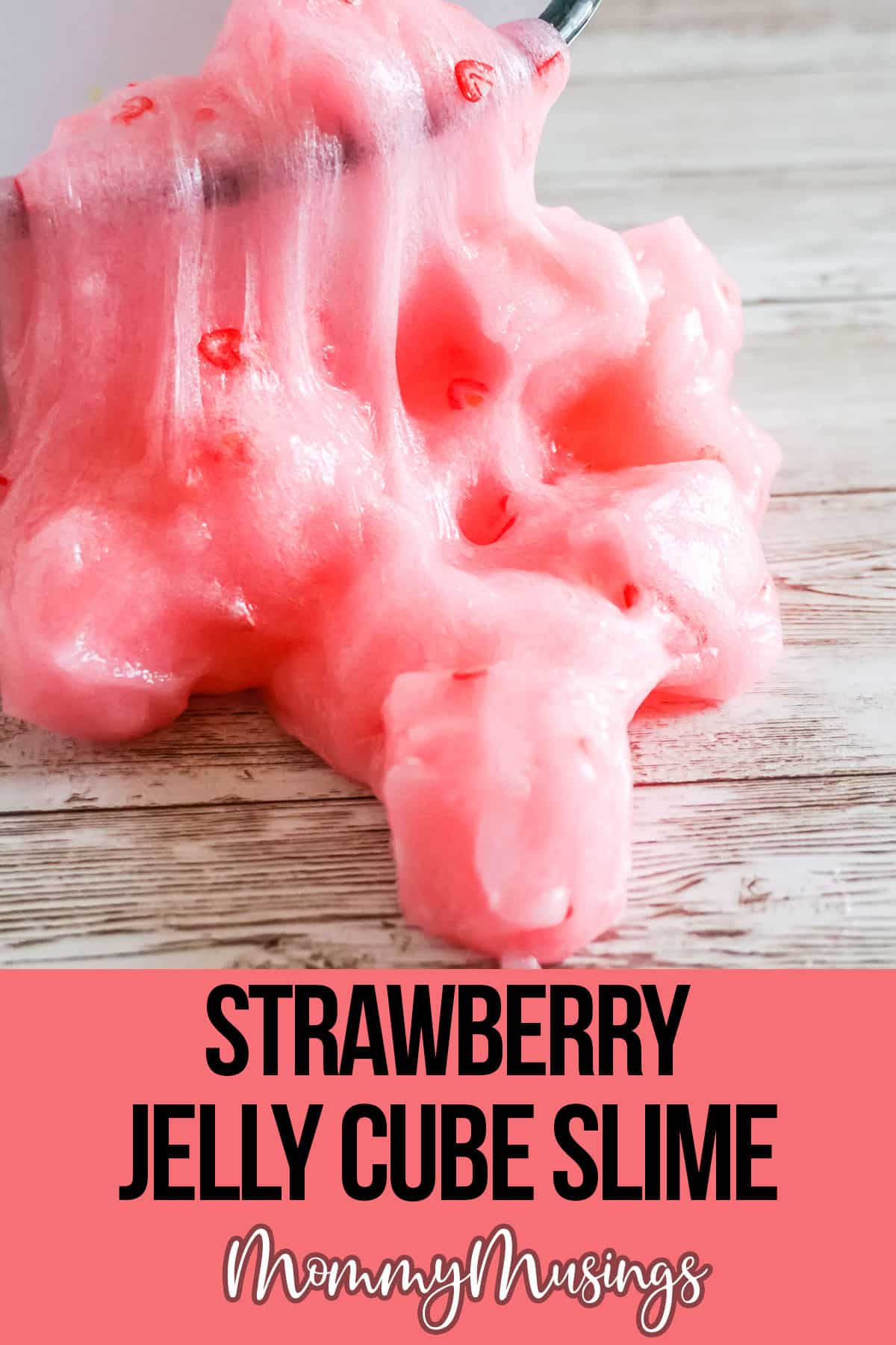 Strawberry slime spilling out of a tiny bathtub onto the table with text which reads strawberry jelly cube slime