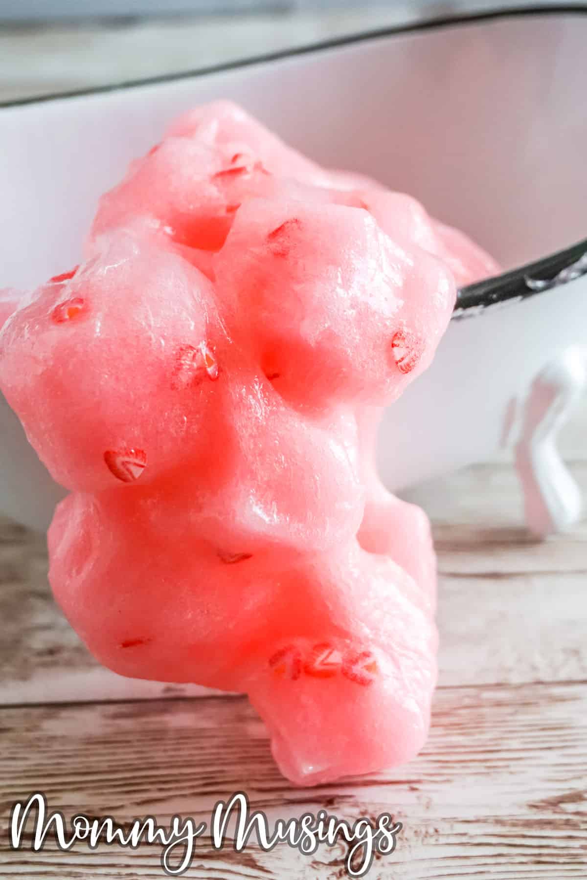 tiny bathtub containing strawberry jelly cube slime