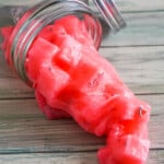 watermelon jelly cube slime spilling onto a table