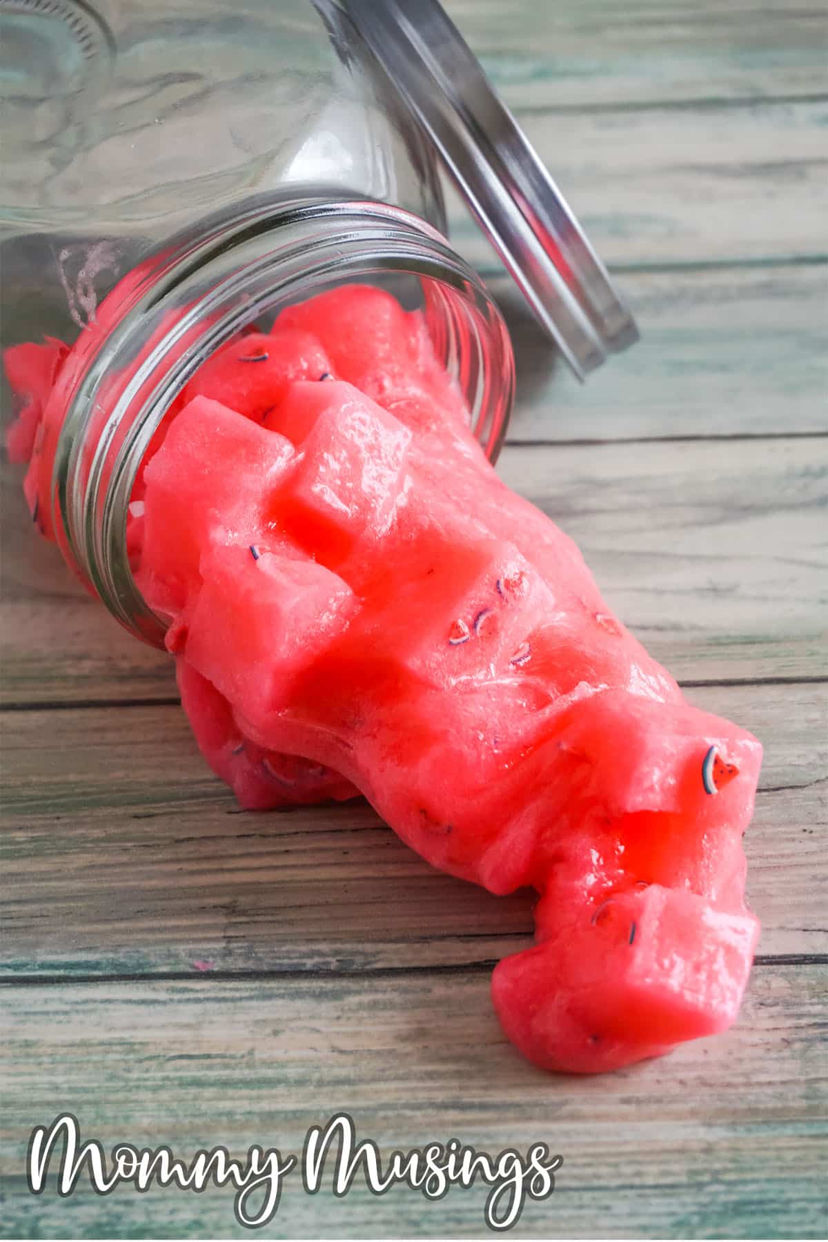 watermelon jelly cube slime spilling onto a table